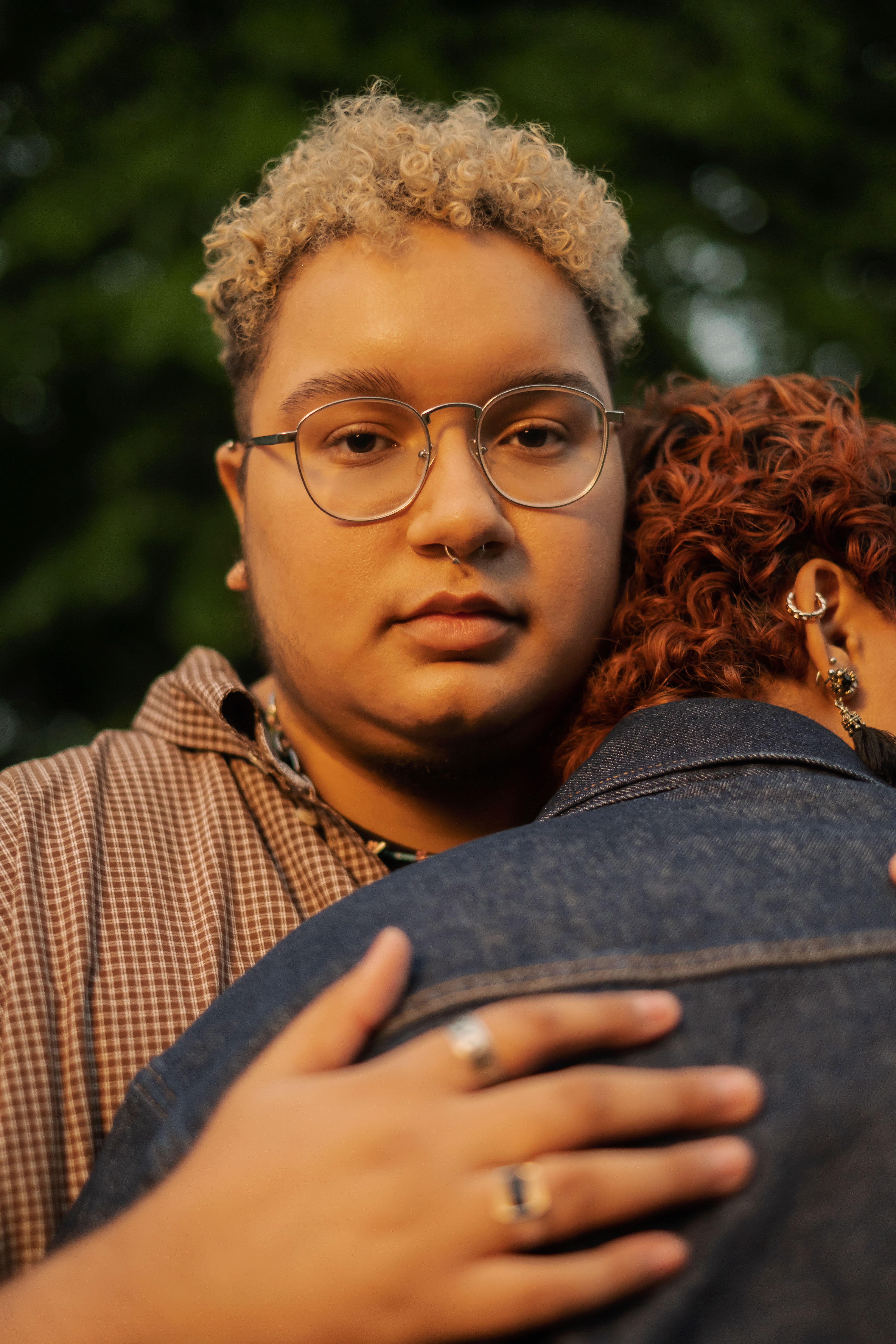 A trans couple embracing outside at dusk(2)